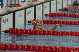 水泳―レース後観客席に笑顔をみせる女性スイマー―オリンピックアクアティックセンターより